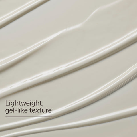 Close-up of a gel-like texture with wavy lines on a light background.