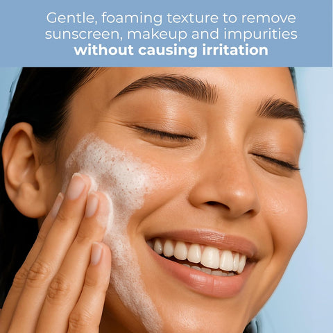 Woman applying foaming cleanser to her face with a blue background and text about product benefits.